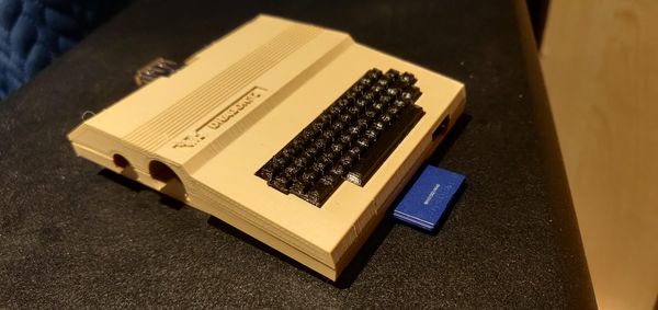 Miniature Dragon 32 Raspberry Pi 1B case with SD card plugged in4